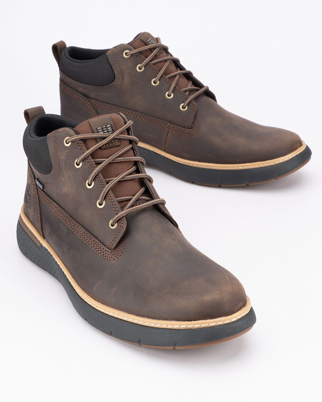 Timberland Waterproof cipele Cross Mark Mid Lace u tamno braon boji predstavljaju spoj prepoznatljivog Timberland dizajna i funkcionalnosti potrebne tokom hladnijih meseci.
